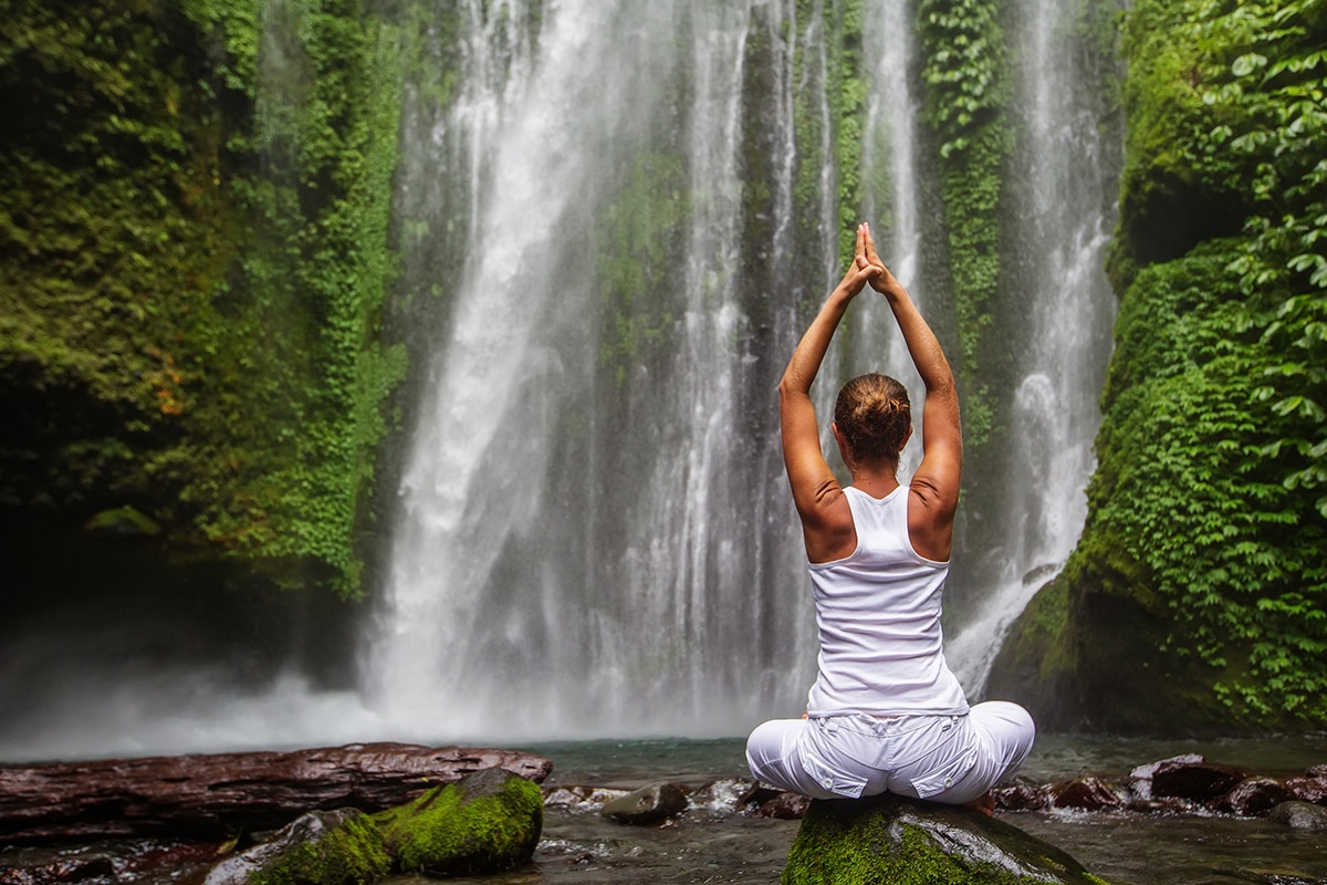yoga in front of a waterfall